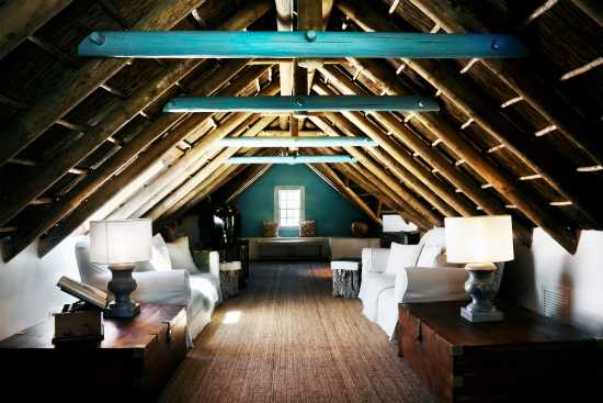 The lounge in the upstairs loft offers a cosy corner to relax in