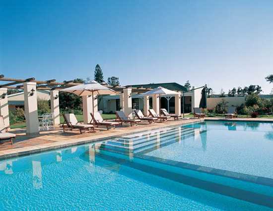 Enjoy a dip in the swimming pool at Riverdene Lodge