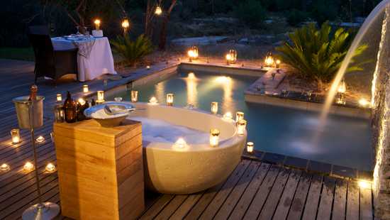 Enjoy soaking in this extra special bath tub outdoors