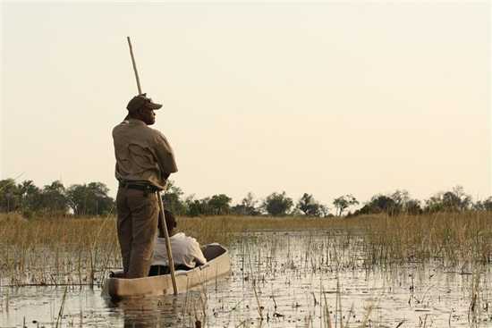 Go on a mokoro ride down the Okavango Delta