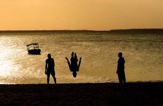 Kids jumping at sunset - Zanzibar