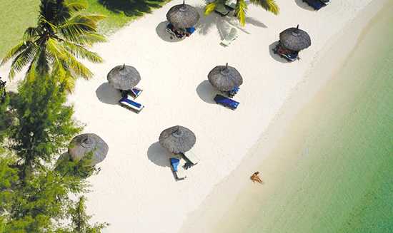 Work on your tan on a beach in Mauritius