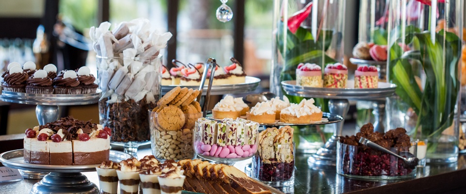 A table set out with treats and flowers at One&Only Hotel