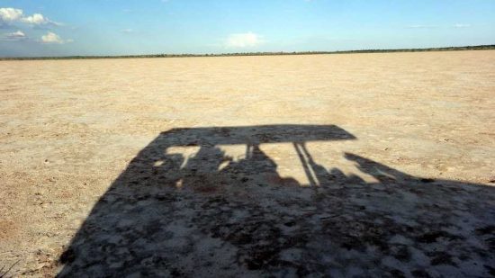 "Our vehicle reflection In the Salt Pan" |From Windhhoek to Bagatelle