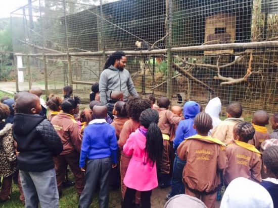 A group of children from Khumbulani learn about monkeys