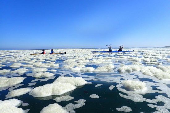 Sea kayakers with bubbles