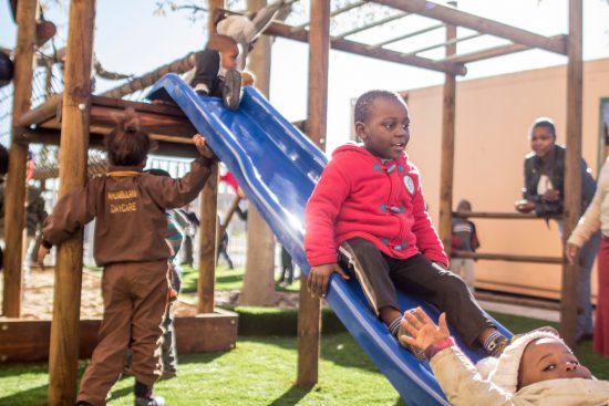 Khumbulani children slide down the new jungle gym