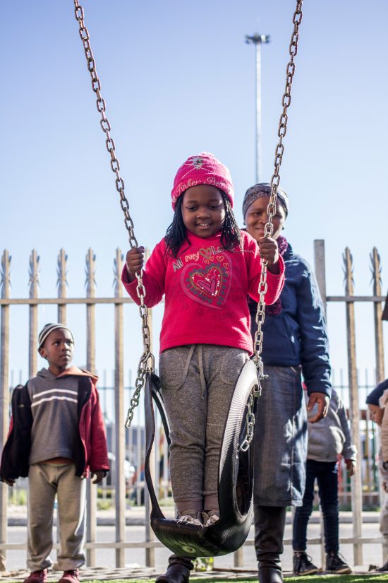 Girl on a swing at Khumbulani 