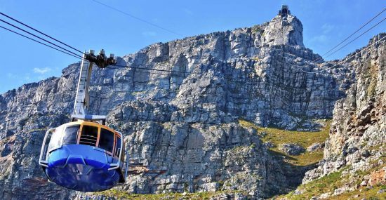 A cable car makes it way to the top of Table Mountain