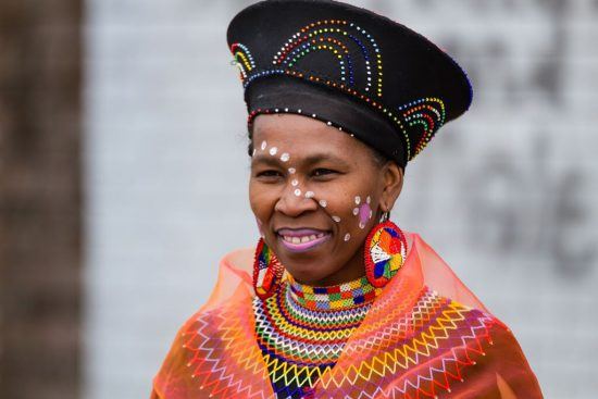 A teacher in splendid traditional dress at Khumbulani's official opening