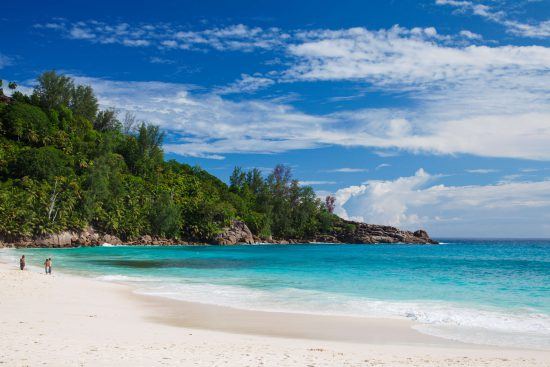 Clear waters lap the shore of Anse Intendance Beach