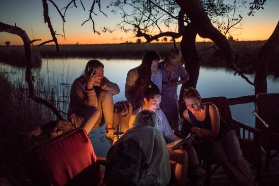 Looking at photos in the okavango delta