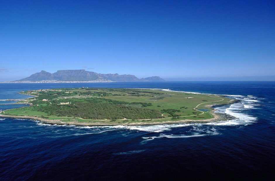 Aerial view of Robben Island with Cape Town in the background