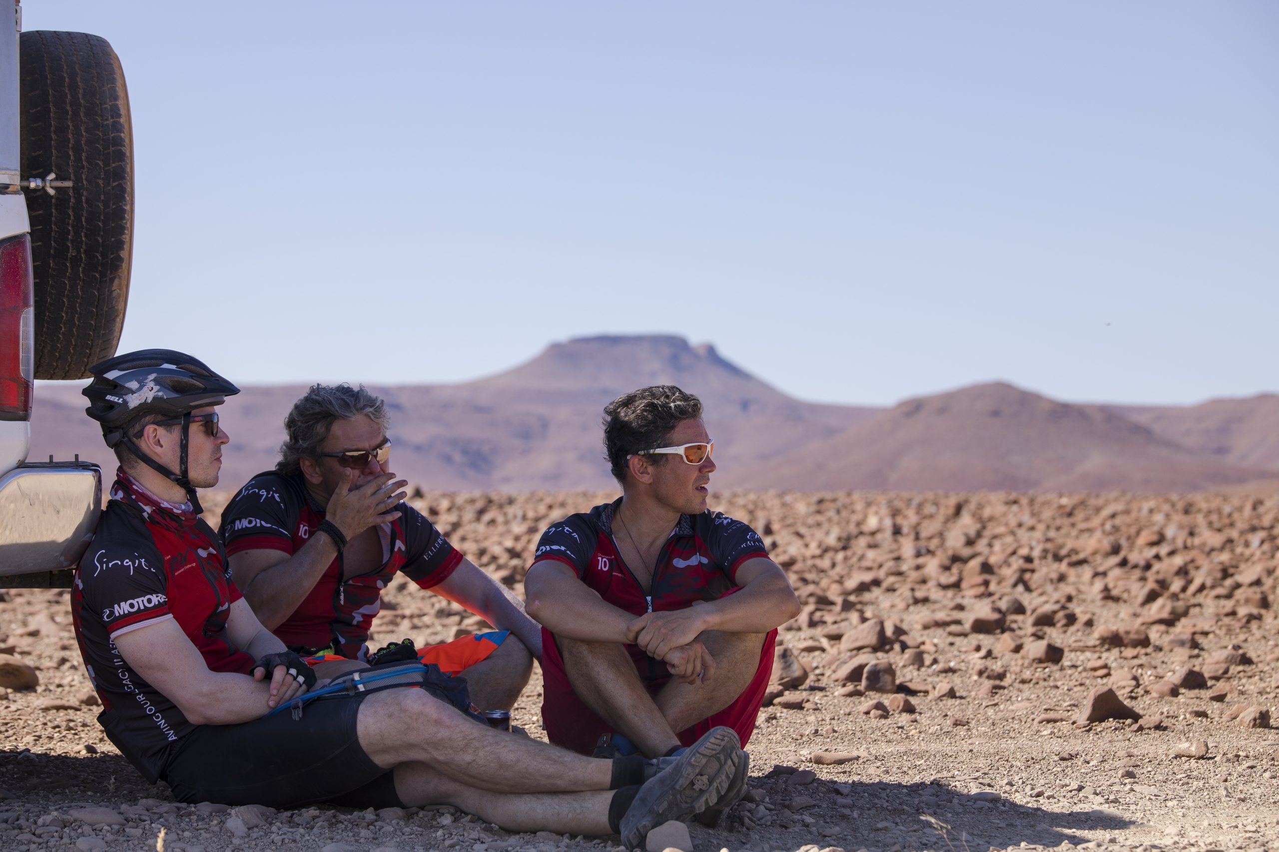 Challenge4ACause cyclists finding shade in the desert