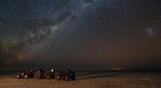 Mythical places in Africa quad bikes under stars in the kalahari