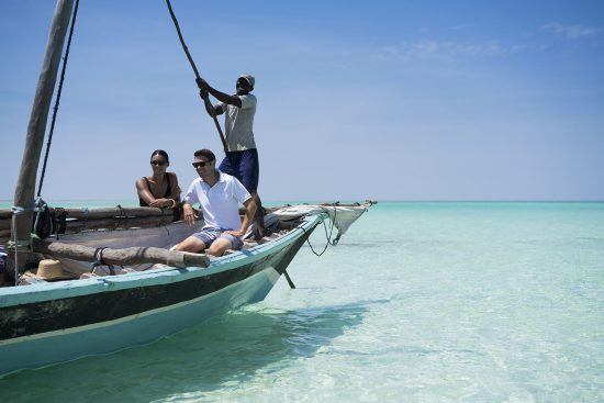 Tourits in a dhow boat in Mozambique