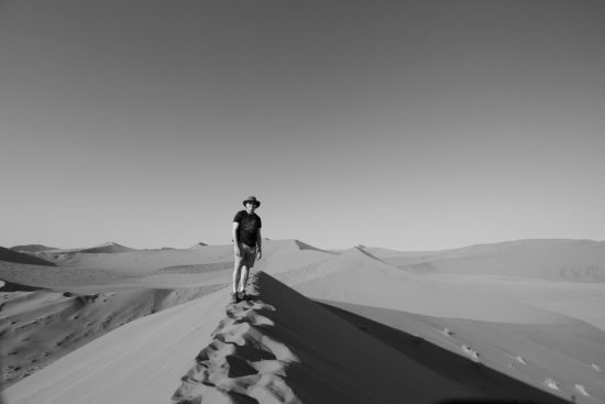 Climbing dunes in the Kalahari of Namibia