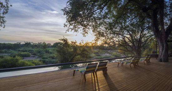 The sun setting over Sabi Sand, seen from Silvan Safari's main deck.