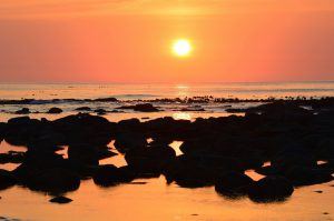 Un des plus beaux couchers de soleil du Cap sur la plage de Kommetjie