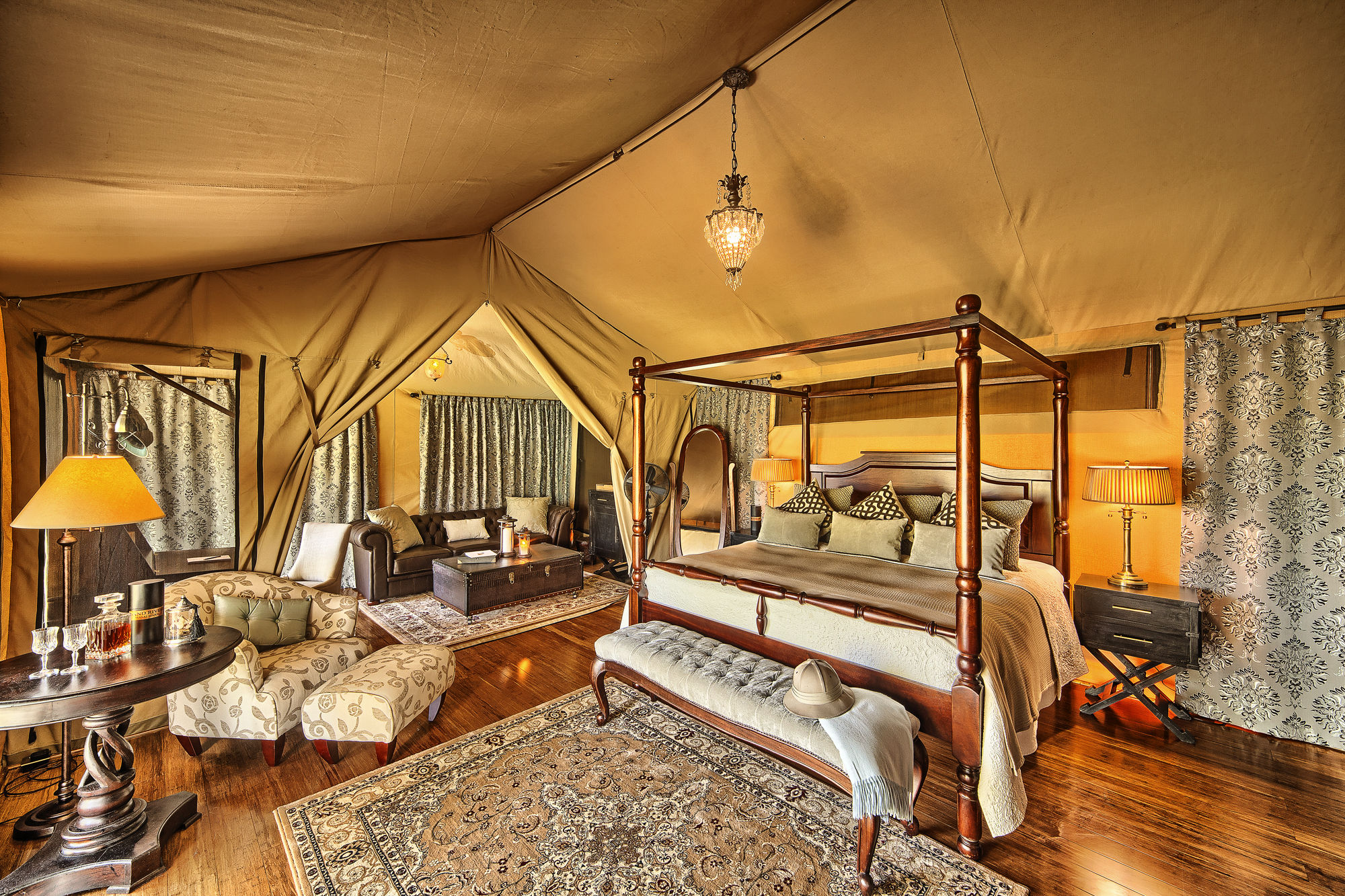 A bedroom in a luxury tent - ideal for experiencing the Great Wildebeest Migration in Africa