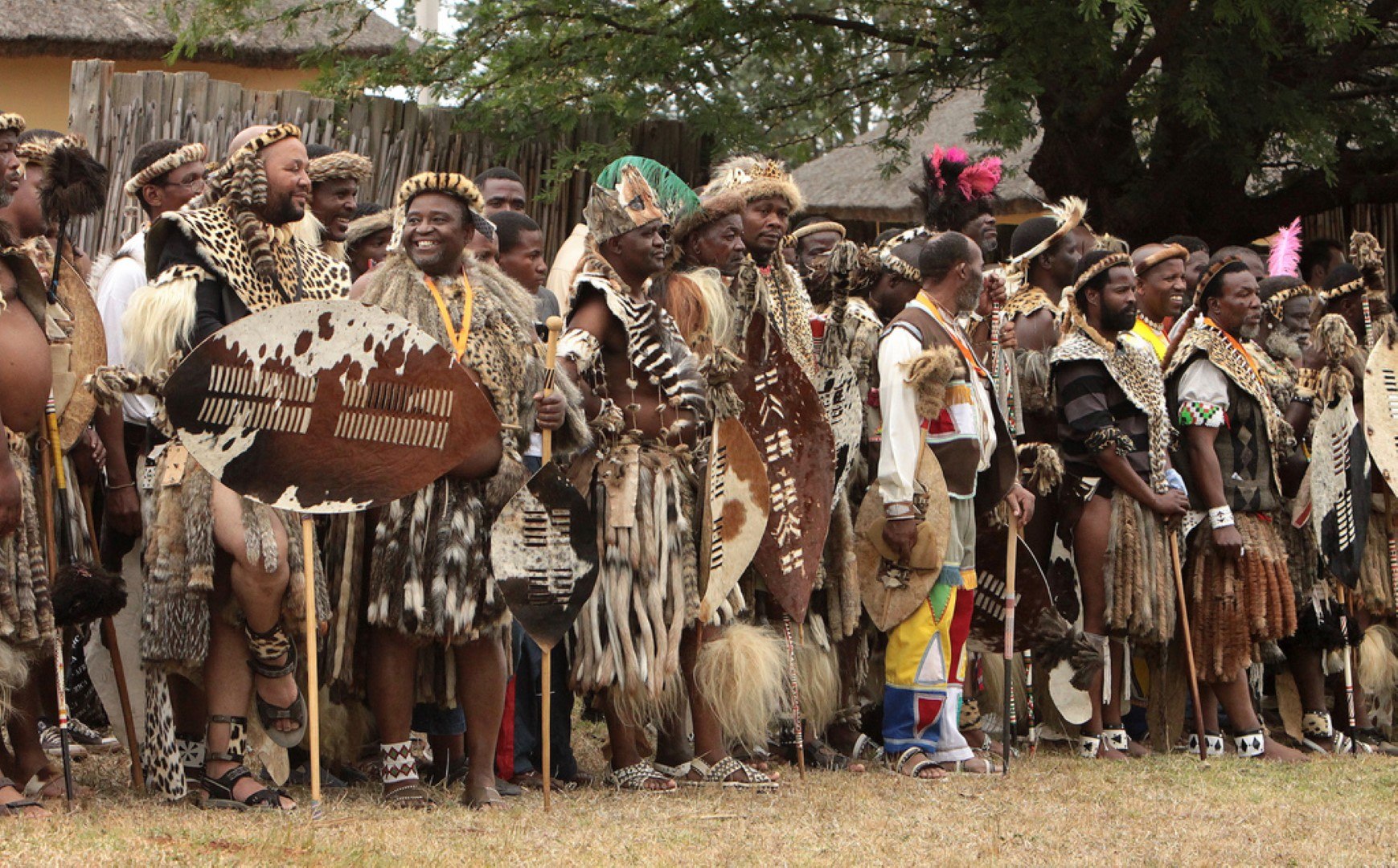 Zulu tribe standing in a line in Rhino Africa's Complete Guide