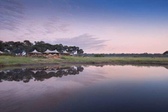 Visit Zimbabwe to admire a sunset like this one spotted at Somalisa Camp