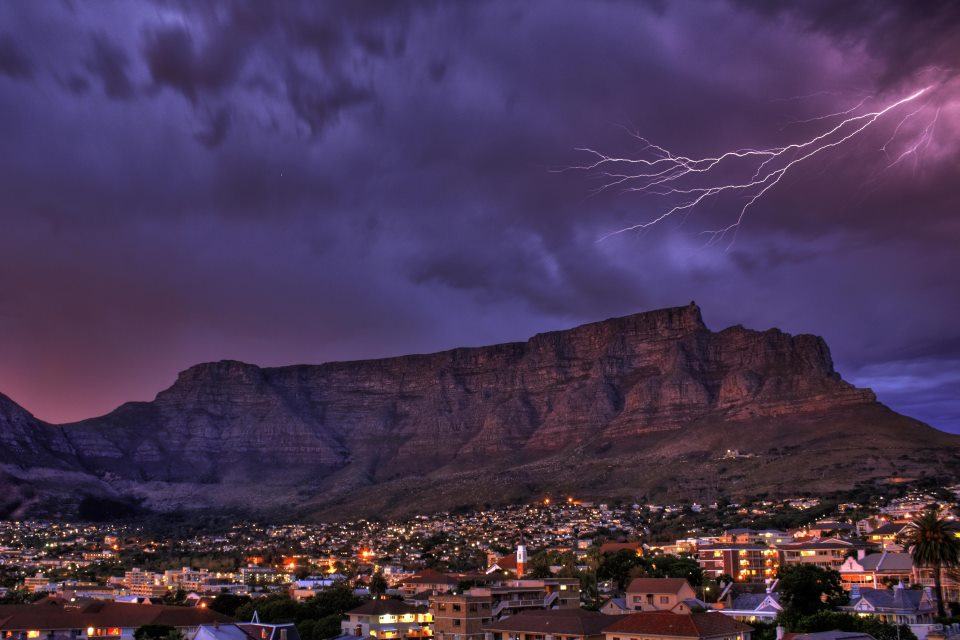 A lightning strike is captured over Table Mountain in winter