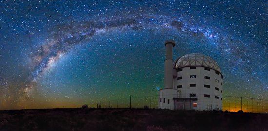 Sutherland's Observatory surrounded by stars at night 