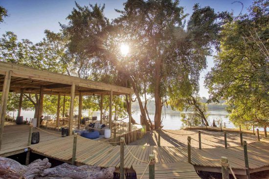 Hippos abound in the waters beyond Victoria Falls Island Lodge