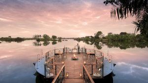 The deck set on the waters surrounding Thorntree River Lodge