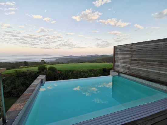 Early morning view over the pool at Delaire Graff