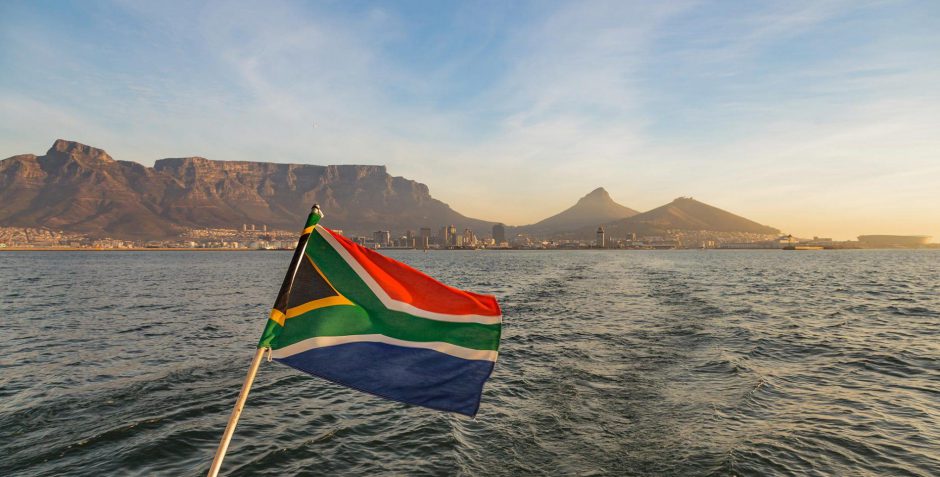 South African Flag waving in front of Table Mountain