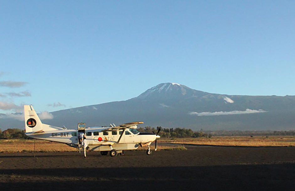 Flying between lodges in East Africa with mount Kilimanjaro in the background