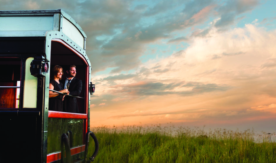 Couple looking out onto African plains from Rovos Rail Luxury Train