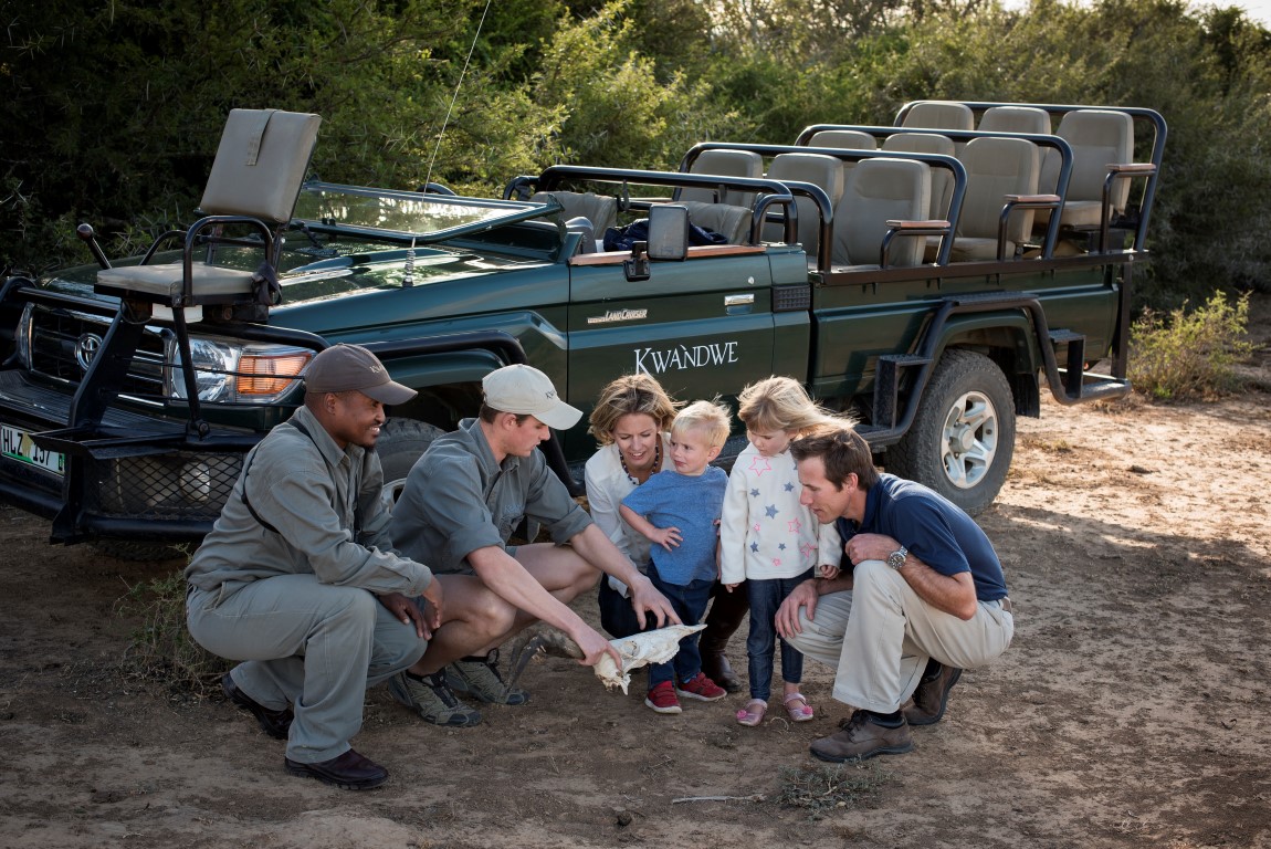 Family on a game drive on safari at Kwandwe Private Game Reserve