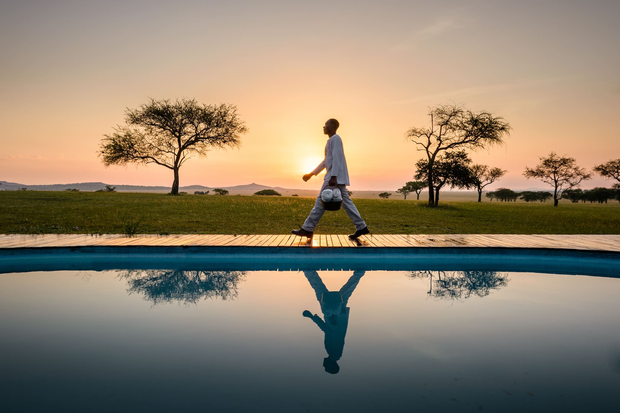 Spectacular sunset over pool at Singita Sabora