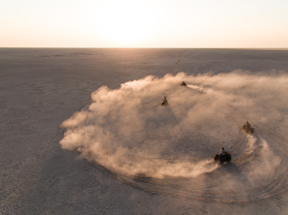 Quad bikes driving across the Makgadikgadi salt pans