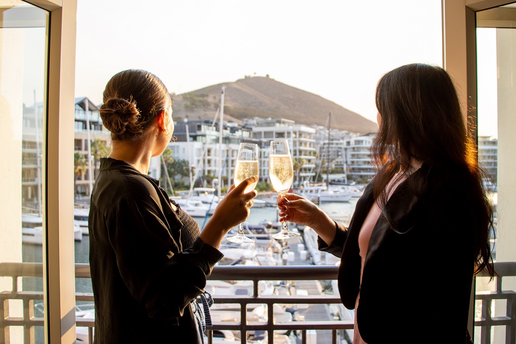 Drinking bubbly and admiring the view of the marina from a room at Cape Grace Hotel & Spa