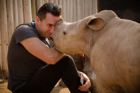 David Ryan CEO of Rhino Africa with a rhino