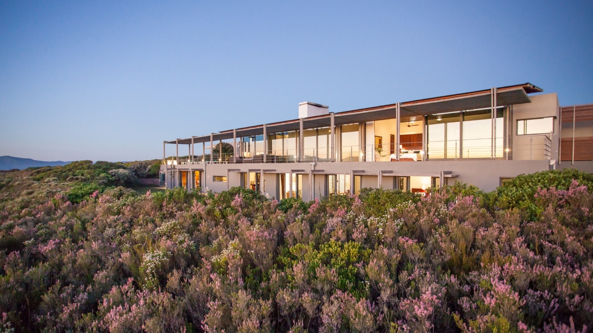 Extravagant villas emerging from a sea of fynbos