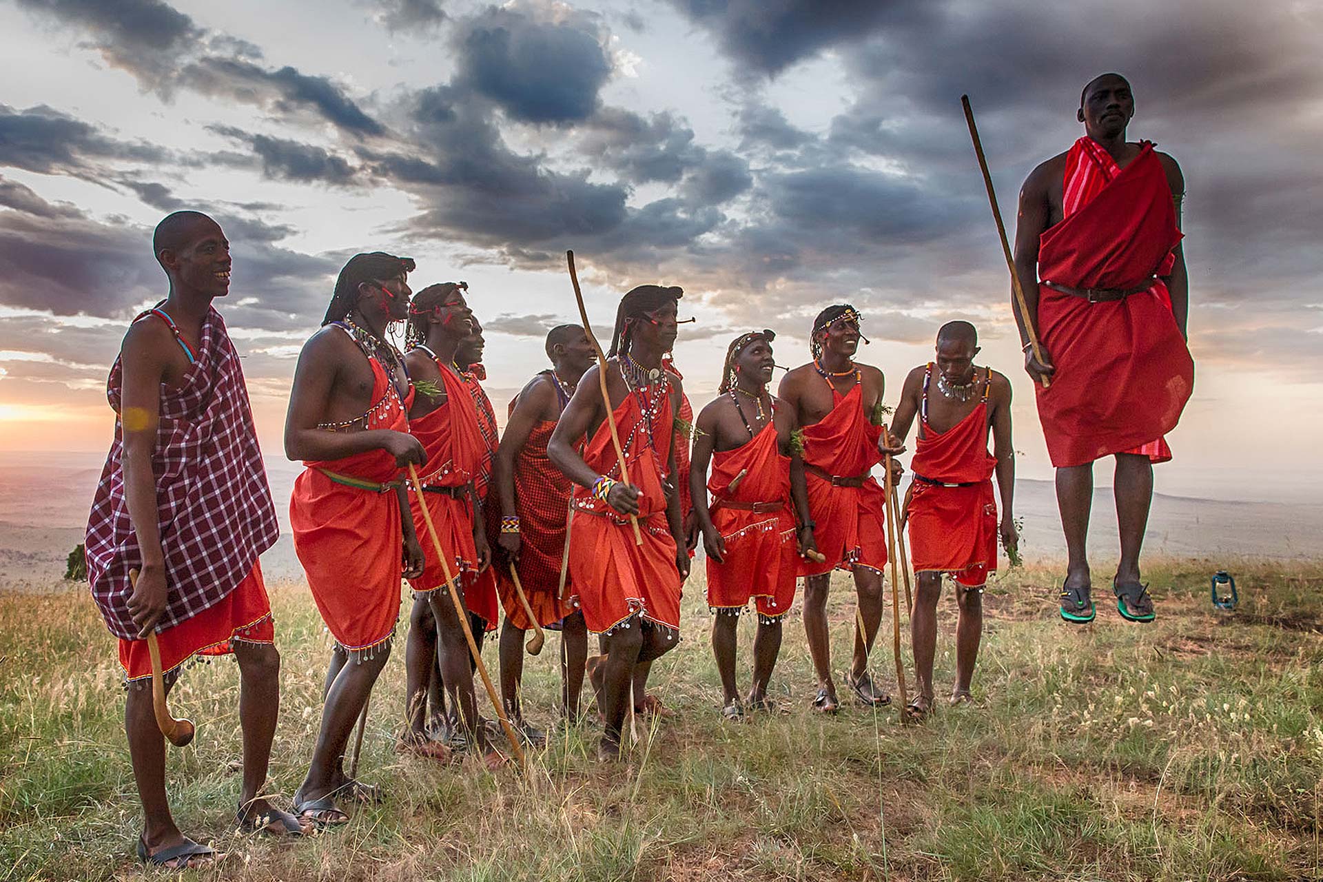 Massai people performing a traditional dance - something that King Charles III was also interested in during his stay