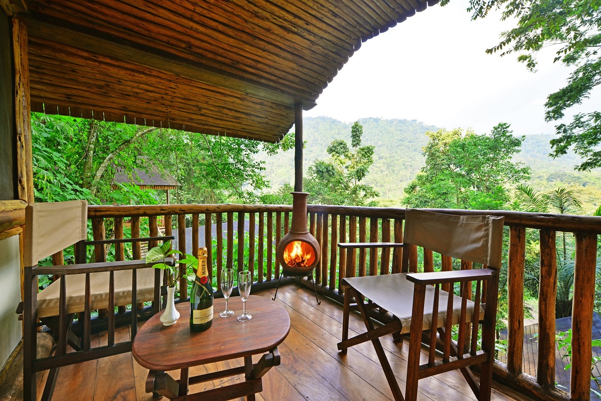 Buhoma Lodge balcony with fireplace and bottle of bubbly