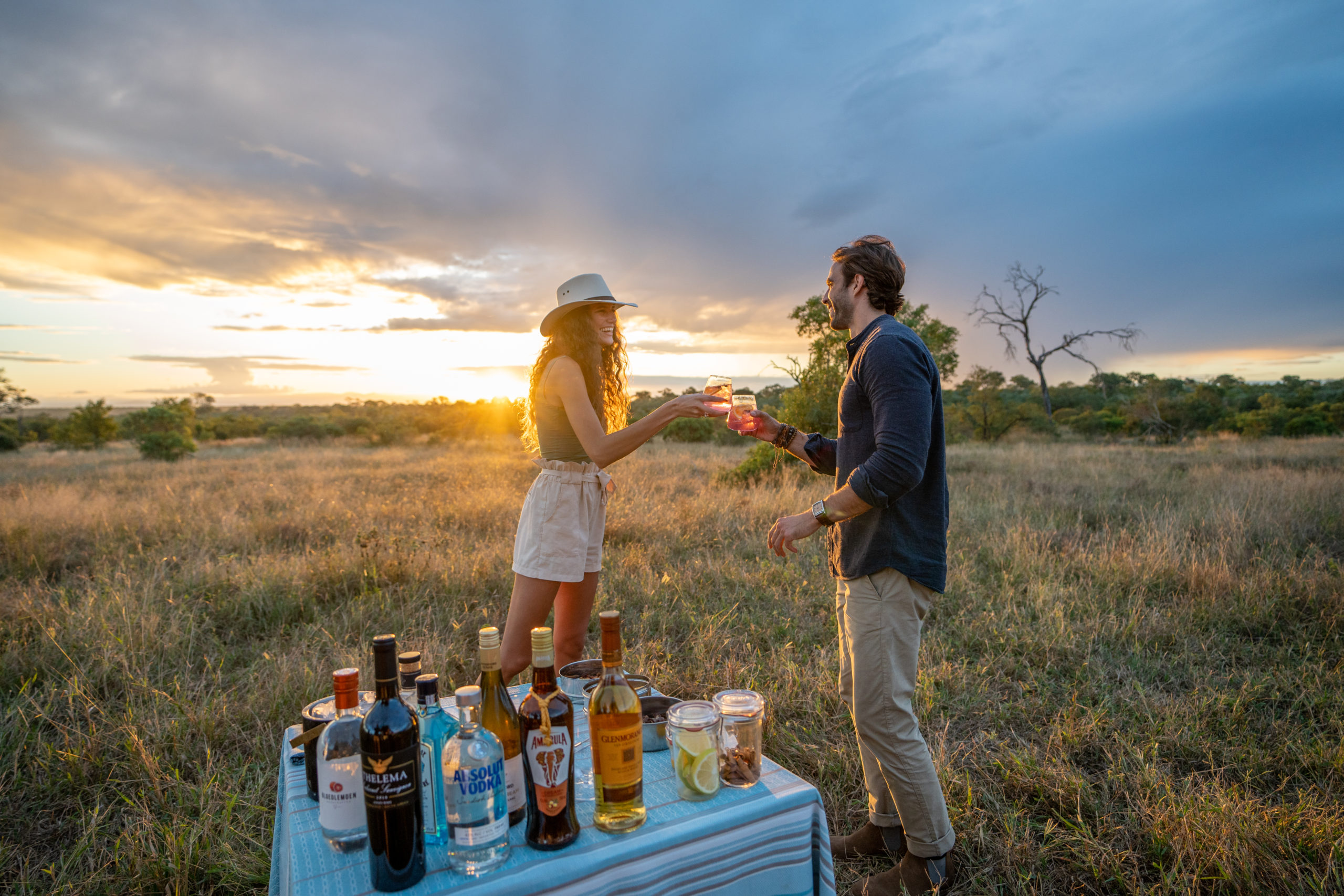 Couple enjoying sundowners on safari at Silvan Safari