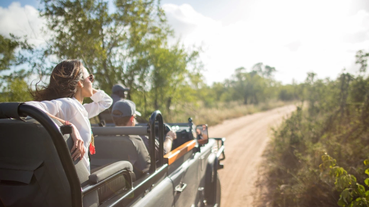 Open 4x4 game drive vehicle driving deeper into Kruger