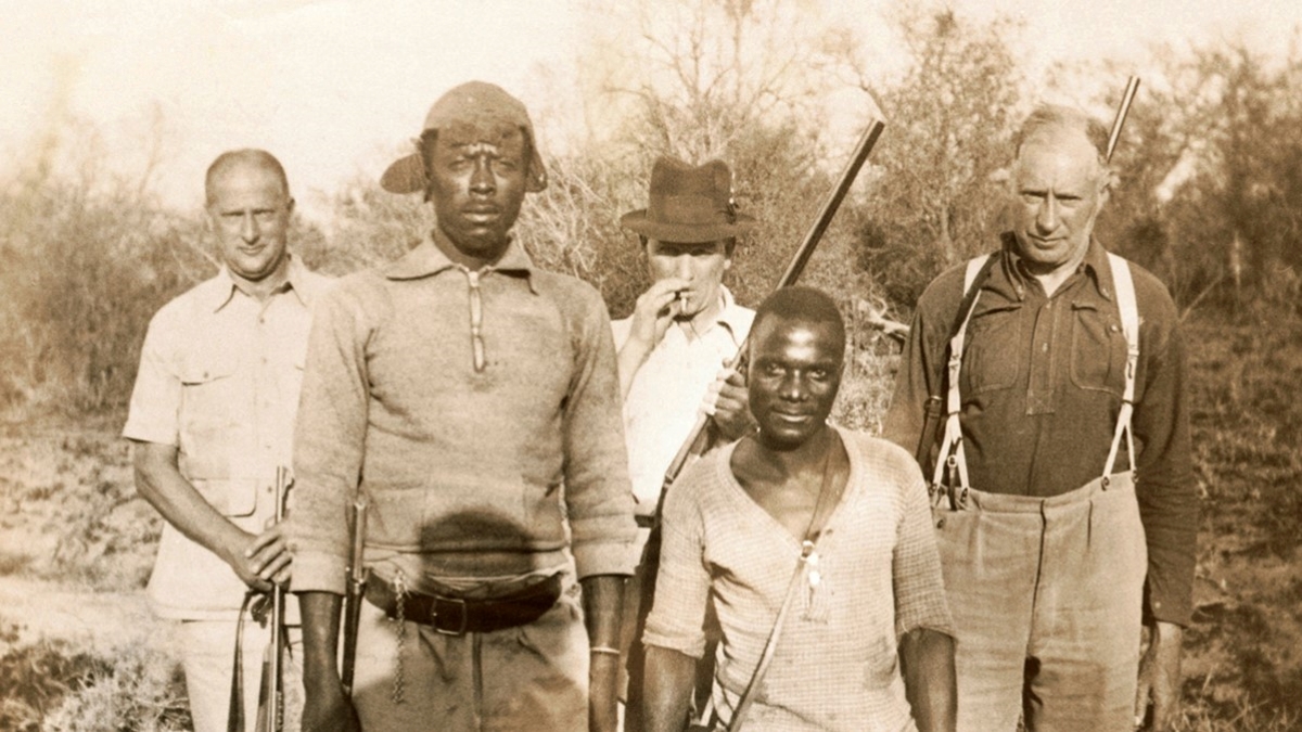 An old sepia photograph featuring Winnis in the early years of safari