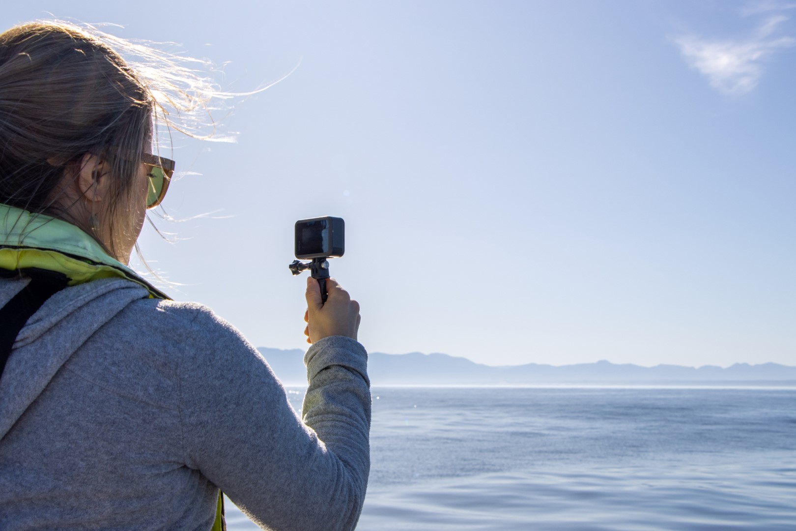 Woman ready to capture any whales we see with Marine Dynamics