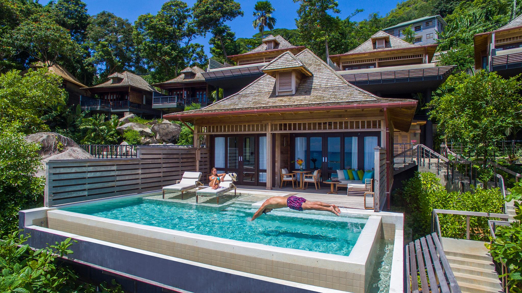 Villa and private pool with man and woman at Hilton Seychelles Northolme Resort & Spa in the Seychelles