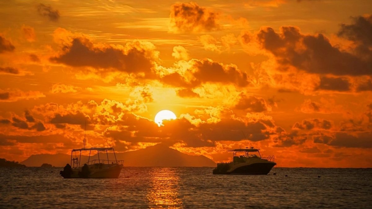 Two fishing boats at sunset