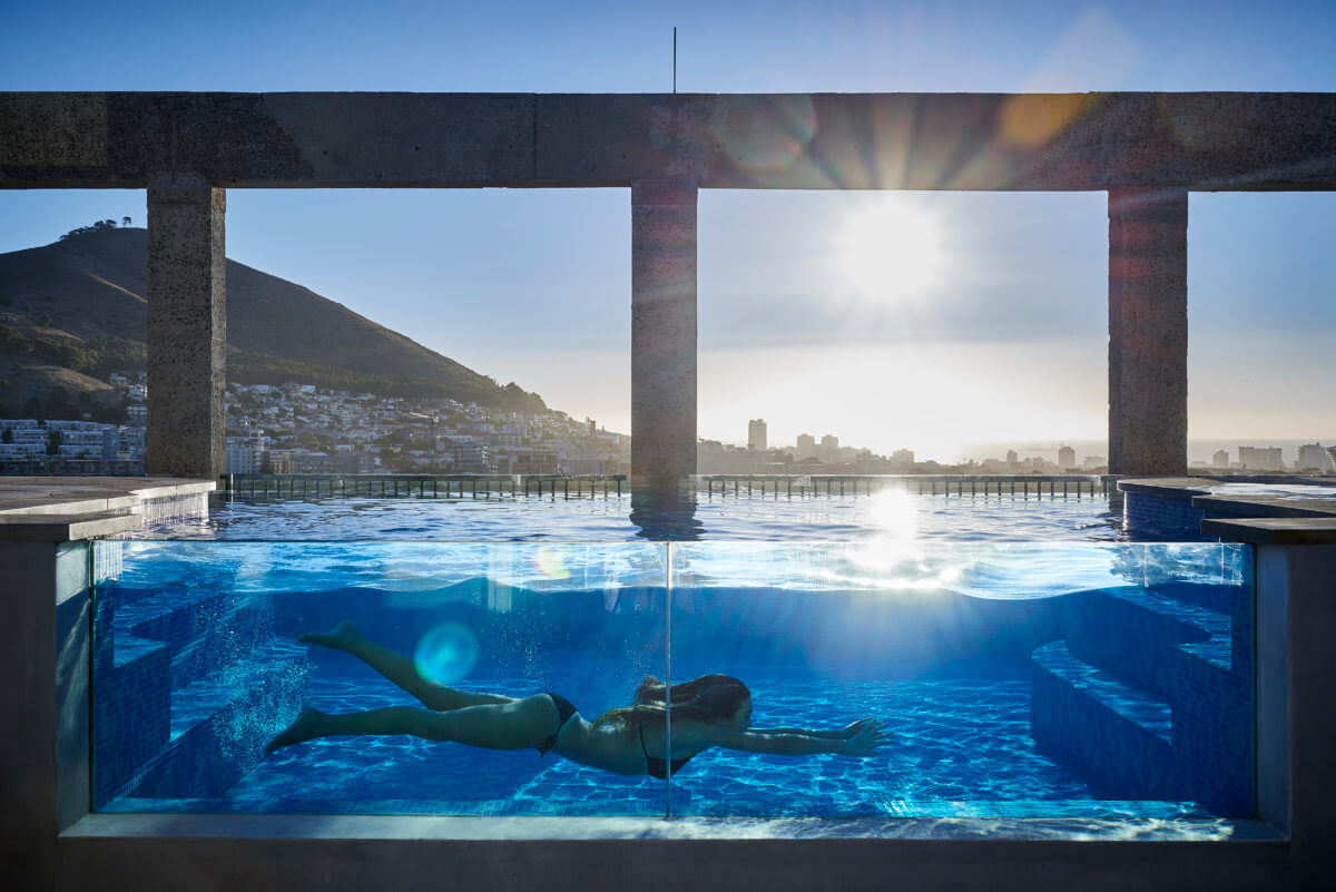 Woman swimming in the rooftop pool at The Silo