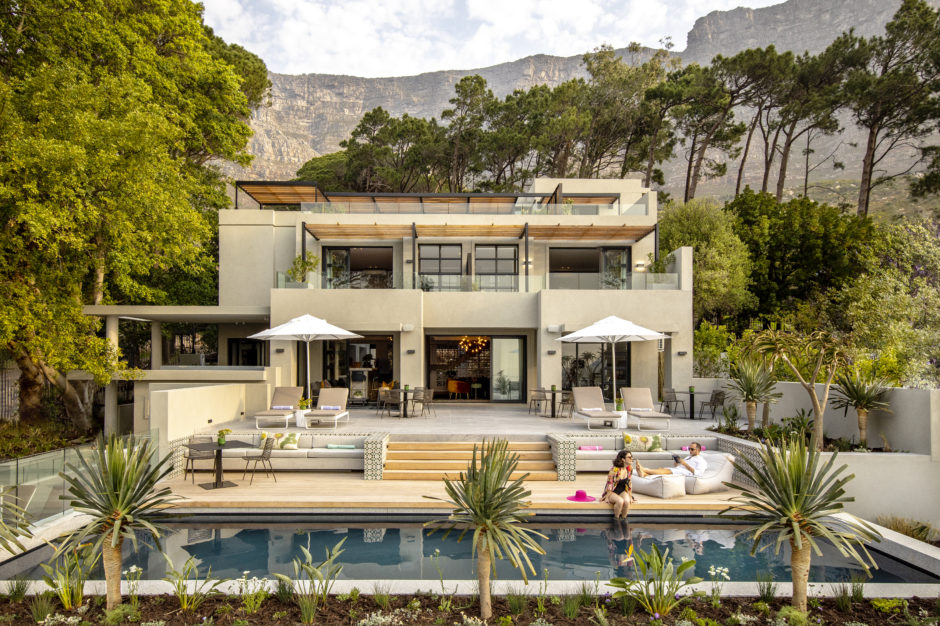 A couple lounging by the pool at Camissa House 